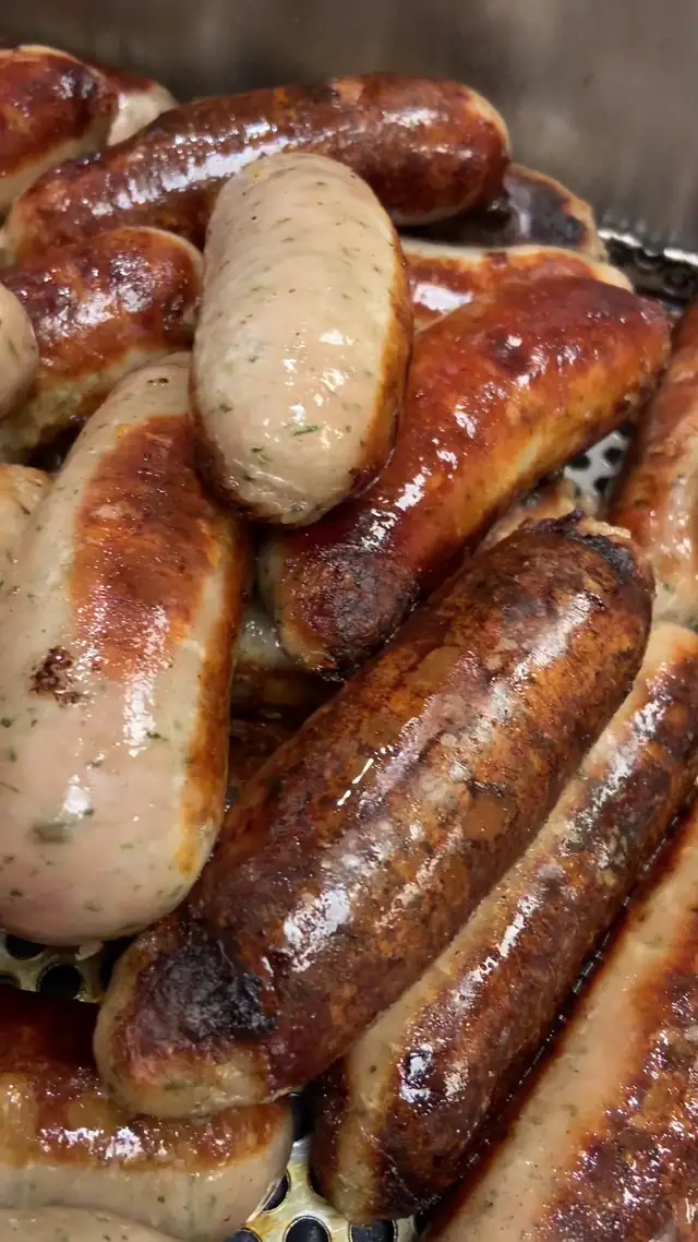Tray of freshly cooked sausages
