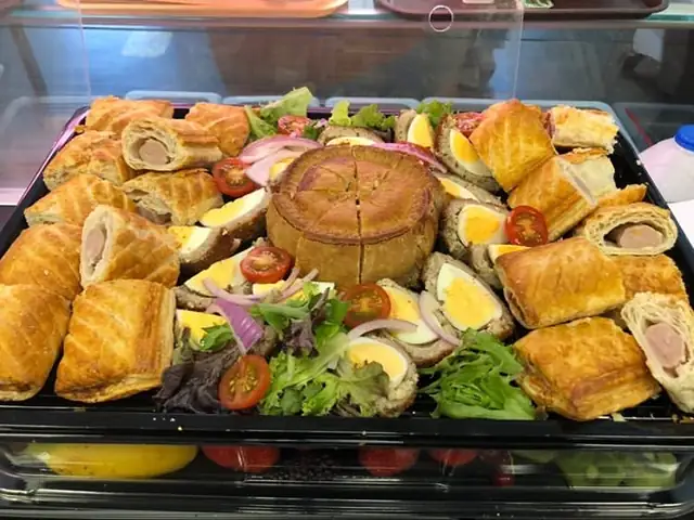 Savoury platter of sausage rolls, pork pie, scotch eggs and salad