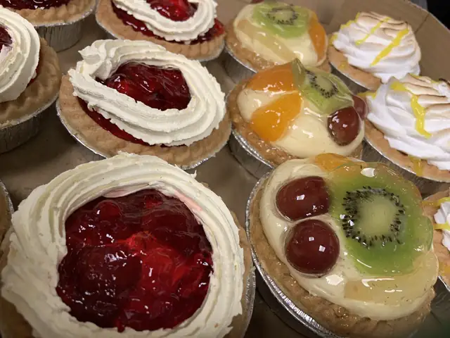 Fruit tarts, jam and cream tarts and lemon meringue
